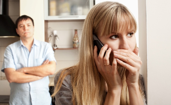 Wife confer privately on the phone