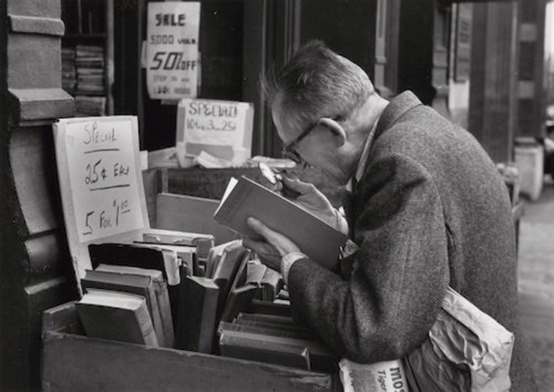 Fourth Avenue, New York (men reading at outdoor book stall), June 4, 1959