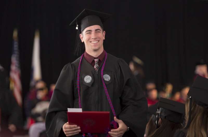 graduation-diploma-male-walking-stage-575x380