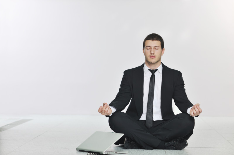 young handsome business man in black suit and tie practice yoga and relax at network server room while representing stres control concept