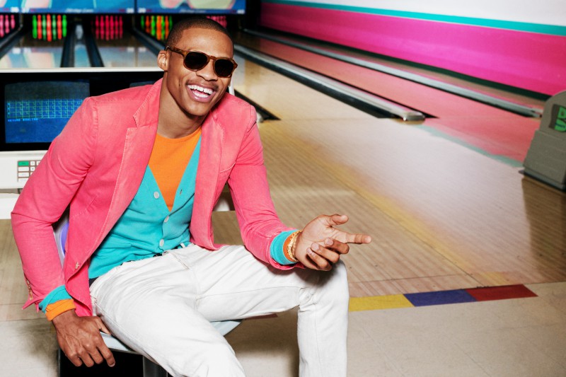 Russell Westbrook STYLE Credits: RALPH LAUREN BLACK LABEL pink sports jacket RALPH LAUREN BLACK LABEL orange sweater RALPH LAUREN PURPLE LABEL teal cardigan RALPH LAUREN BLACK LABEL white jeans RALPH LAUREN BLACK LABEL slippers OMEGA gold watch WARBY PARKER tortious sunglasses PHOTO CREDIT: Ben Watts Grooming by Hee Soo Styling by Brian Coats